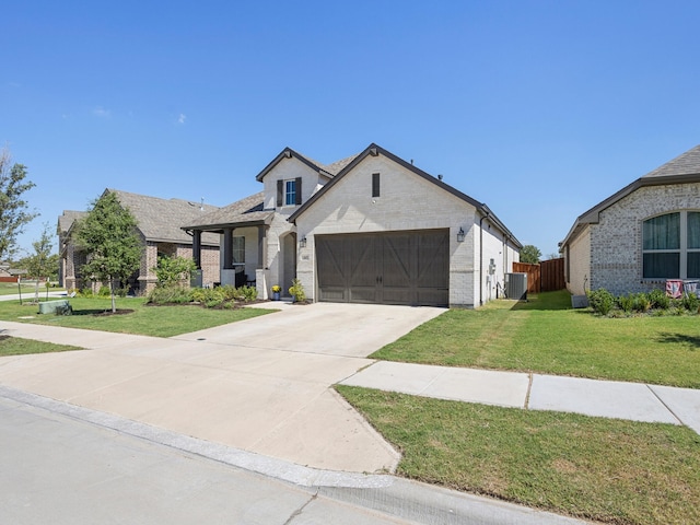 view of front facade featuring central AC unit, a garage, and a front lawn