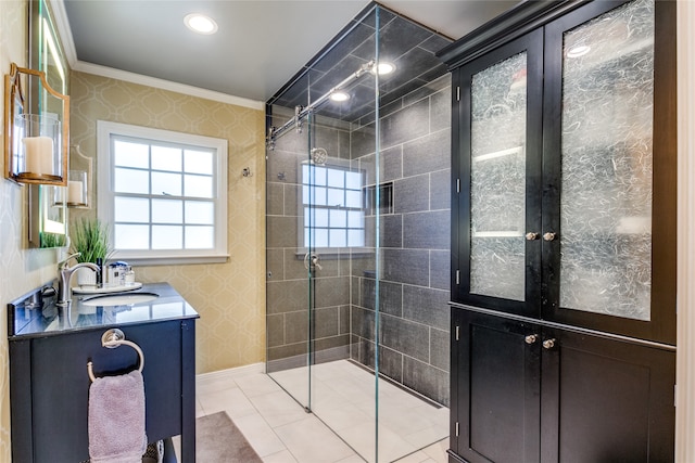 bathroom with vanity, tile patterned floors, an enclosed shower, and crown molding