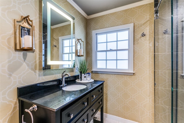 bathroom with a tile shower, vanity, and crown molding