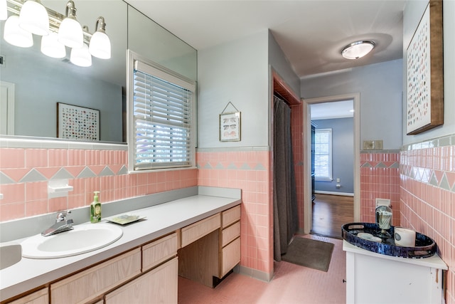 bathroom featuring vanity, tile walls, and hardwood / wood-style floors