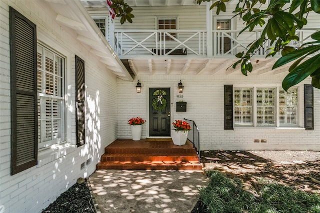 view of exterior entry with a porch