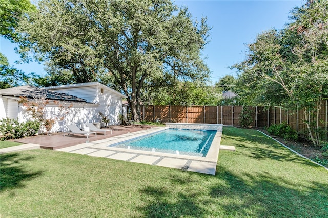 view of pool with a lawn