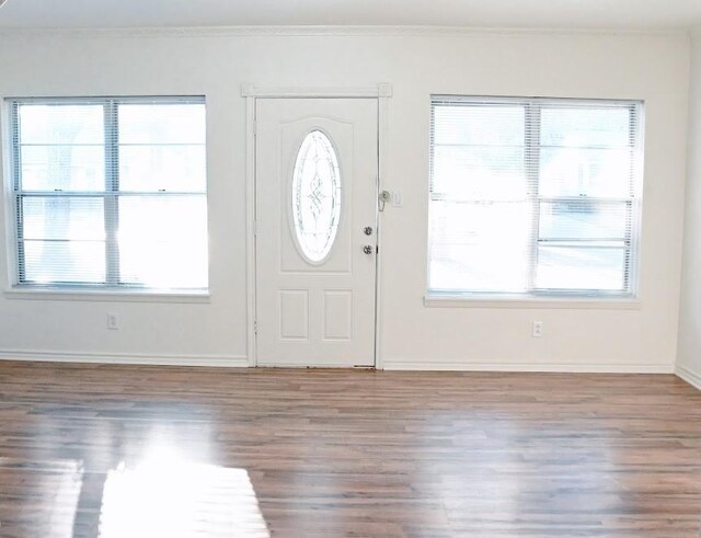 spare room featuring hardwood / wood-style floors and built in features