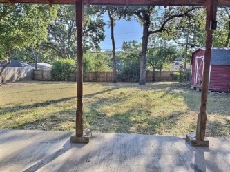 view of yard with a storage unit