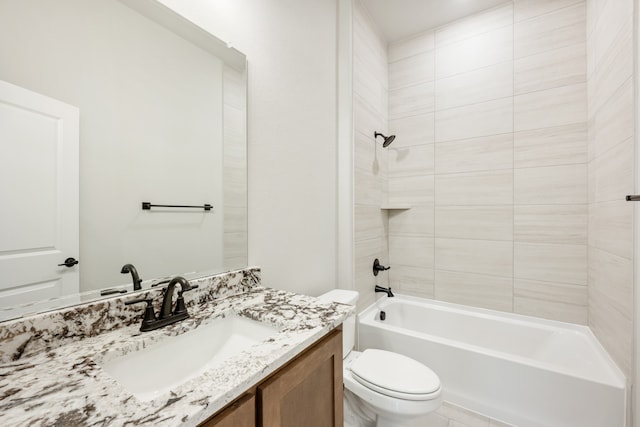 full bathroom featuring vanity, tiled shower / bath combo, and toilet