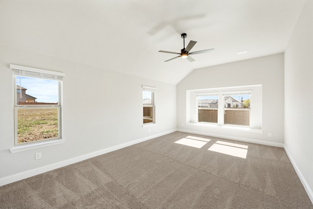 unfurnished room with ceiling fan, carpet floors, and lofted ceiling