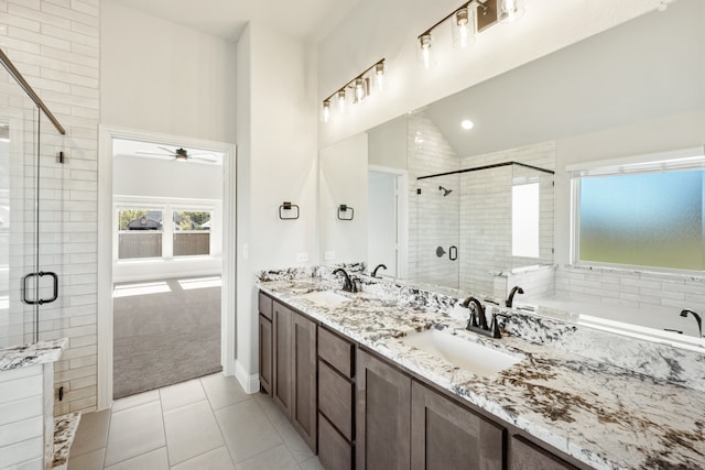 bathroom with vanity, lofted ceiling, tile patterned flooring, ceiling fan, and shower with separate bathtub