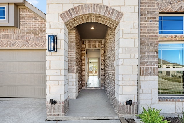 view of exterior entry featuring a garage