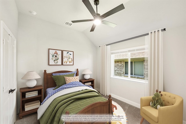 carpeted bedroom with vaulted ceiling and ceiling fan