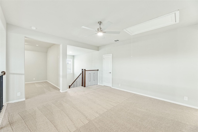 unfurnished room featuring ceiling fan and light colored carpet