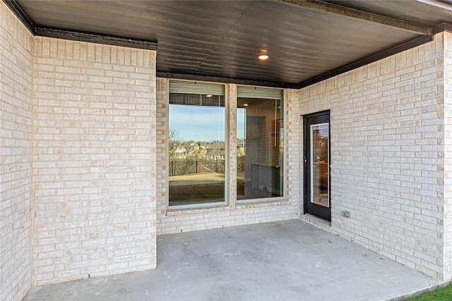 property entrance with a patio area