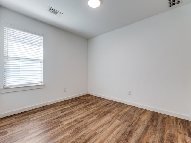 empty room featuring wood-type flooring