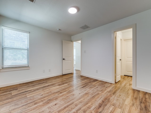 unfurnished bedroom featuring light hardwood / wood-style floors