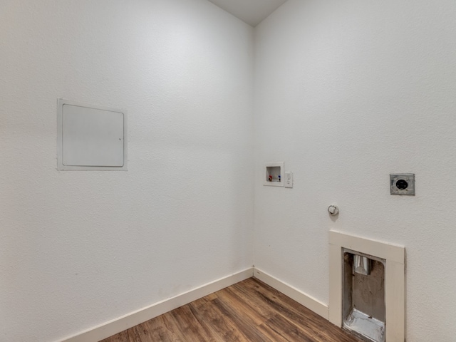 clothes washing area with hookup for a washing machine, dark hardwood / wood-style flooring, hookup for a gas dryer, and electric dryer hookup