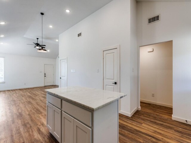 unfurnished living room featuring light hardwood / wood-style flooring, plenty of natural light, and lofted ceiling