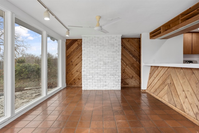 interior space with ceiling fan and rail lighting