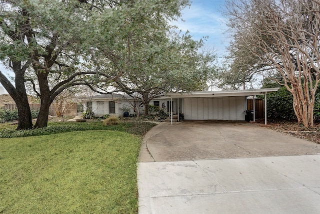 single story home with a carport and a front yard