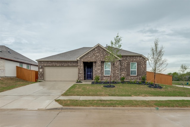 3725 Blooming Prairie Dr, Crandall, TX 75114 - view of front of house featuring fence, driveway, a front yard, brick siding, and a garage