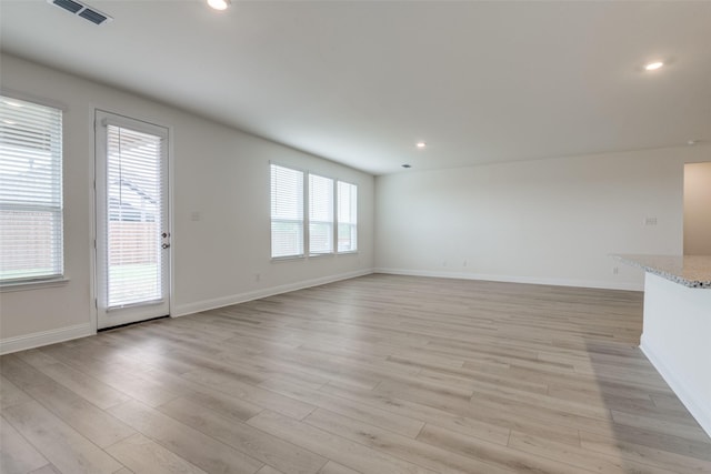 3725 Blooming Prairie Dr, Crandall, TX 75114 - unfurnished living room featuring baseboards, visible vents, recessed lighting, and light wood-type flooring