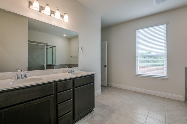 3725 Blooming Prairie Dr, Crandall, TX 75114 - bathroom featuring double vanity, a sink, a stall shower, and baseboards