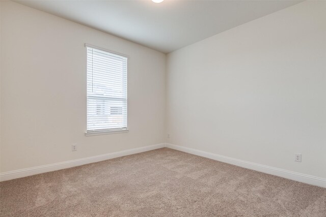 3725 Blooming Prairie Dr, Crandall, TX 75114 - empty room featuring light carpet and baseboards