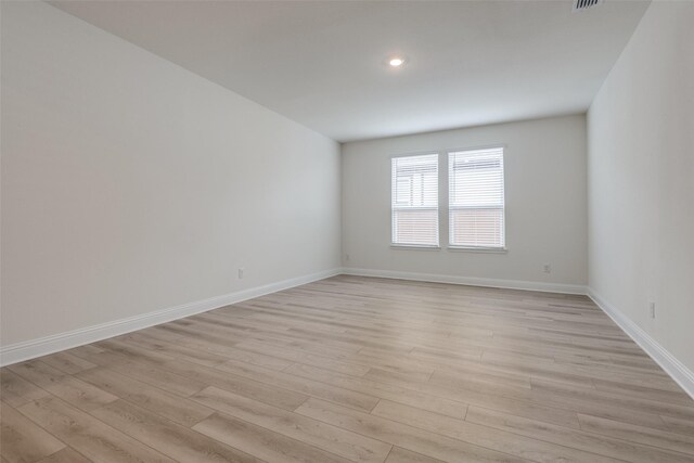 3725 Blooming Prairie Dr, Crandall, TX 75114 - spare room with baseboards, visible vents, and light wood-style flooring