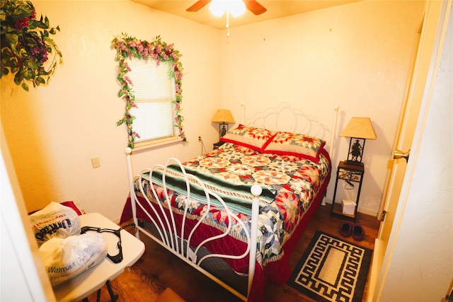 bedroom with hardwood / wood-style flooring and ceiling fan