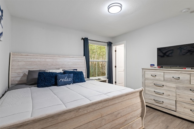 bedroom featuring light wood-type flooring