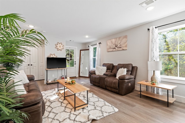 living room with light hardwood / wood-style flooring