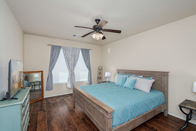 bedroom featuring ceiling fan and dark hardwood / wood-style floors