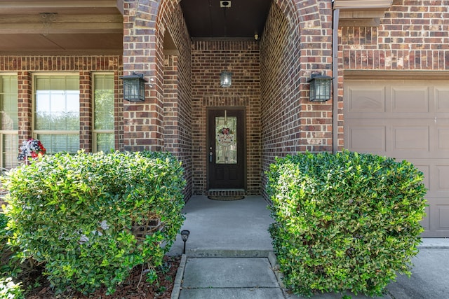 entrance to property featuring a garage