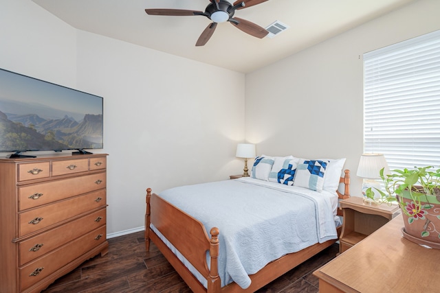 bedroom featuring ceiling fan and dark hardwood / wood-style floors