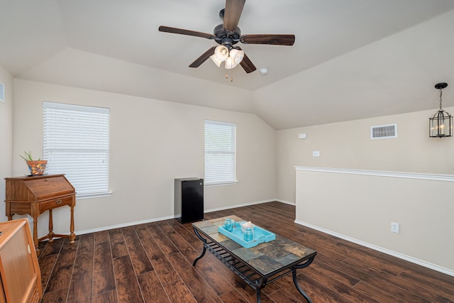 living area with vaulted ceiling, dark hardwood / wood-style flooring, and ceiling fan