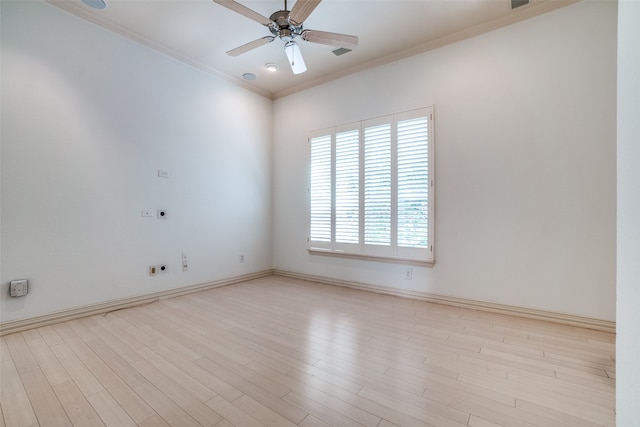 empty room with ceiling fan, ornamental molding, and light hardwood / wood-style floors