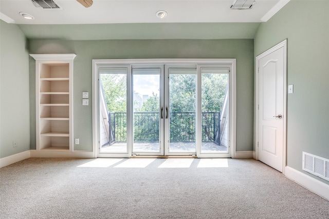 interior space with baseboards, visible vents, and carpet flooring