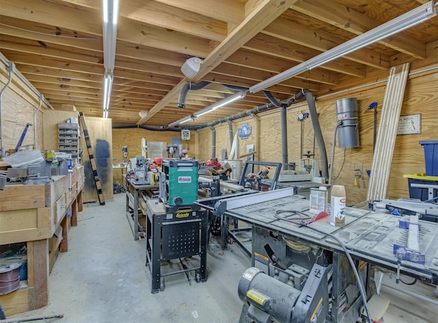 interior space featuring concrete floors and a workshop area