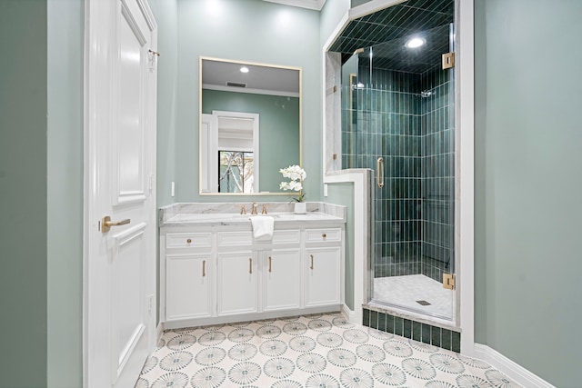 bathroom with walk in shower, vanity, and ornamental molding