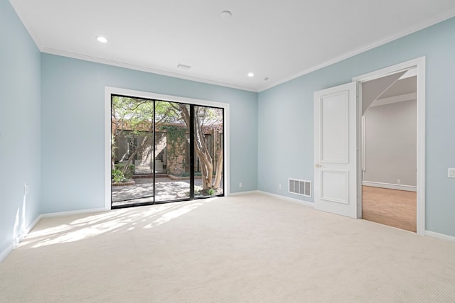 unfurnished room featuring crown molding and light carpet