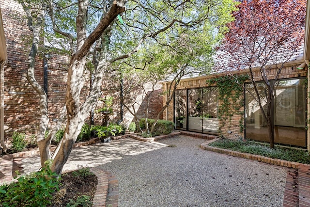 view of yard with a sunroom and a patio area