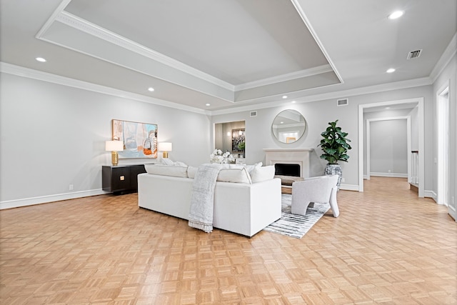 living room featuring light parquet flooring and ornamental molding