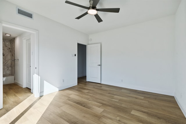 unfurnished bedroom with ceiling fan and light hardwood / wood-style flooring