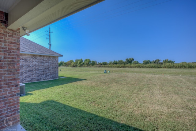 view of yard with central AC