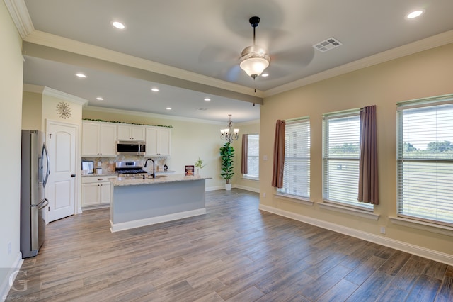 kitchen featuring a kitchen island with sink, light hardwood / wood-style flooring, light stone counters, appliances with stainless steel finishes, and white cabinetry