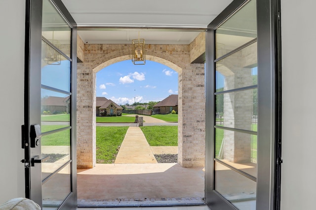 entryway with brick wall