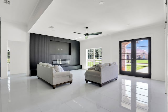 living room featuring ceiling fan, crown molding, and french doors