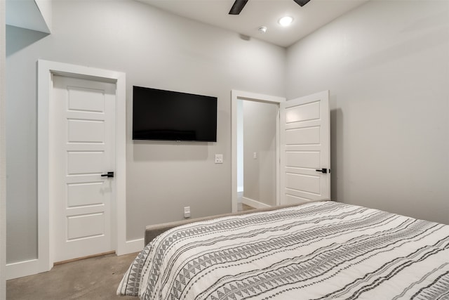 bedroom with ceiling fan and light colored carpet