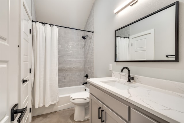 full bathroom featuring shower / bath combo, vanity, and toilet