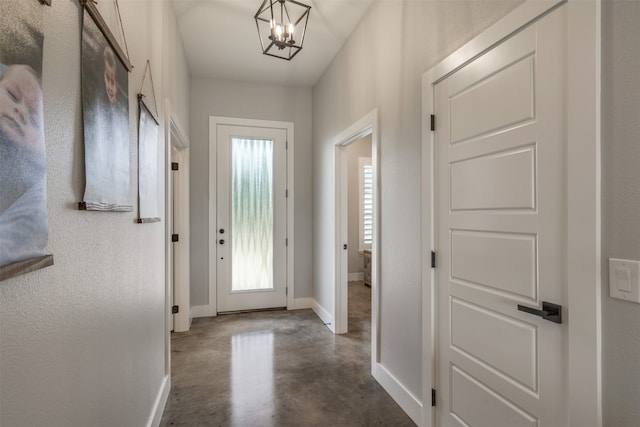 foyer with an inviting chandelier