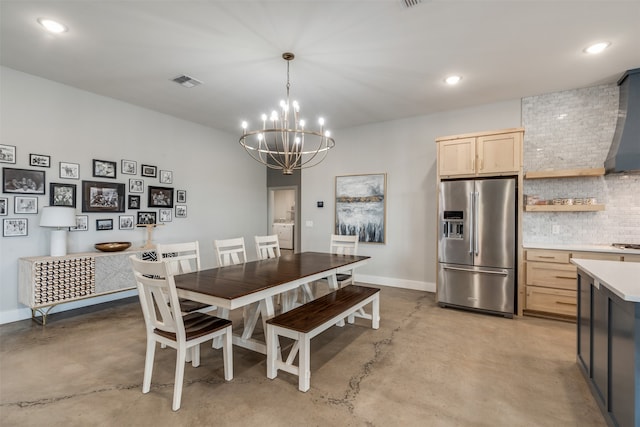 dining space featuring a chandelier