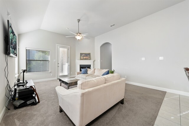 living room with lofted ceiling, carpet floors, and ceiling fan